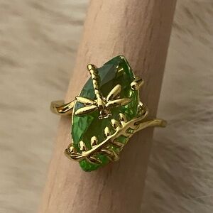 Elegant Green Gemstone Ring with Gold Detailing